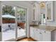 Built-in wet bar with granite countertop and mirrored cabinets at 371 Live Palmetto Bluff, Mount Pleasant, SC 29464