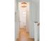Small, bright bathroom with white fixtures and wood flooring at 429 Venning St, Mount Pleasant, SC 29464