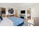Bright bedroom with a blue bed, walk-in closet, and ensuite bathroom at 429 Venning St, Mount Pleasant, SC 29464