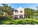 Charming pink house with a spacious backyard, lush green lawn, and patio at 429 Venning St, Mount Pleasant, SC 29464