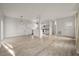 Open concept kitchen and living area with white cabinets and hardwood floors at 5748 Pilgrim Ave # D, Hanahan, SC 29410