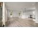 Open concept kitchen and living area with white cabinets and hardwood floors at 5748 Pilgrim Ave # D, Hanahan, SC 29410