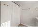 Simple bathroom with shower, white curtain and wood-look floors at 5748 Pilgrim Ave # D, Hanahan, SC 29410