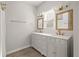 Elegant bathroom with double vanity, marble countertop, and gold fixtures at 5748 Pilgrim Ave # D, Hanahan, SC 29410