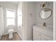 Modern bathroom with white vanity and gold accents at 5748 Pilgrim Ave # D, Hanahan, SC 29410