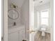 Clean bathroom with white vanity, gold accents and a tub at 5748 Pilgrim Ave # D, Hanahan, SC 29410