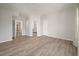 Bright bedroom with wood-look floors and access to bathroom at 5748 Pilgrim Ave # D, Hanahan, SC 29410