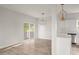 Bright dining room with hardwood floors and sliding glass door to outdoor space at 5748 Pilgrim Ave # D, Hanahan, SC 29410