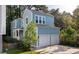Exterior view of a charming two-story home with light blue siding and white accents at 5748 Pilgrim Ave # D, Hanahan, SC 29410