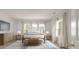 Bright bedroom with a queen-size bed, dresser, and two nightstands at 5748 Pilgrim Ave # D, Hanahan, SC 29410