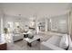 Open concept living and dining area with modern kitchen at 5748 Pilgrim Ave # D, Hanahan, SC 29410