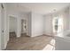 Upstairs hallway with doors to bedrooms and natural light at 5748 Pilgrim Ave # D, Hanahan, SC 29410