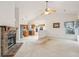 Living room with kitchen view, fireplace, and carpet at 103 Isherwood Dr, Goose Creek, SC 29445