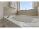 Bathroom with soaking tub and tile surround at 1242 Homecoming Blvd # Cc2-5-18, Ravenel,  29470