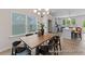 Dining room with wood table and chairs, adjacent to kitchen at 1242 Homecoming Blvd # Cc2-5-18, Ravenel,  29470