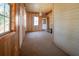 Sunroom with wood paneling, carpet, and exterior access at 1393 Secessionville Rd, Charleston,  29412