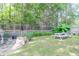 Landscaped backyard with a picnic table and fire pit at 1421 Oldenburg Dr, Mount Pleasant, SC 29429