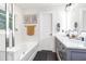 Modern bathroom with double vanity, marble countertop and soaking tub at 1421 Oldenburg Dr, Mount Pleasant, SC 29429