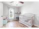 Peaceful Bedroom with crib, window, and floating shelf at 1421 Oldenburg Dr, Mount Pleasant, SC 29429