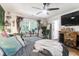 Cozy bedroom with a large TV, lots of plants and a comfy bed at 1421 Oldenburg Dr, Mount Pleasant, SC 29429