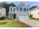 Two-story house with gray siding, black shutters, and a two-car garage at 1421 Oldenburg Dr, Mount Pleasant, SC 29429