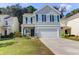 Two-story house with gray siding, black shutters, and a two-car garage at 1421 Oldenburg Dr, Mount Pleasant, SC 29429
