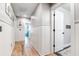 Bright hallway with white wainscoting and wood flooring at 1421 Oldenburg Dr, Mount Pleasant, SC 29429
