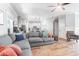Spacious living room with hardwood floors, gray sectional sofa, and kitchen view at 1421 Oldenburg Dr, Mount Pleasant, SC 29429