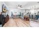 Spacious living room with hardwood floors, gray sectional sofa, and kitchen view at 1421 Oldenburg Dr, Mount Pleasant, SC 29429