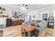 Spacious living room with hardwood floors, gray sectional sofa, and large TV at 1421 Oldenburg Dr, Mount Pleasant, SC 29429