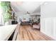 Spacious living room with hardwood floors, gray sectional sofa, and large TV at 1421 Oldenburg Dr, Mount Pleasant, SC 29429