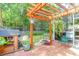 Relaxing patio area with pergola and hanging swing at 1421 Oldenburg Dr, Mount Pleasant, SC 29429