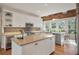 Spacious kitchen with granite island, stainless steel appliances, and wood floors at 151 Augusta National Ct, Kiawah Island, SC 29455