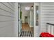 Bright and airy entryway with a black and white checkered rug at 1515 Barquentine Dr, Mount Pleasant, SC 29464