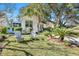 Charming white cottage with a manicured lawn and inviting seating area at 1515 Barquentine Dr, Mount Pleasant, SC 29464