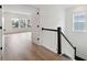 Upstairs hallway with hardwood floors and staircase at 1643 Siloh Dr # 485, Mount Pleasant, SC 29466