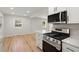 Stylish kitchen with stainless steel appliances and white cabinetry at 1897 Halo Ln, Charleston,  29407