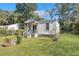 House exterior showcasing a gray siding and a well-maintained lawn at 2671 Olympia Ave, North Charleston, SC 29405