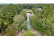 Aerial view of a pond surrounded by lush green trees at 3034 Cane Slash Rd, Johns Island, SC 29455