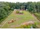Aerial view of land with construction equipment and containers at 3034 Cane Slash Rd, Johns Island, SC 29455