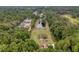 Aerial view of property showing pond, trees, and neighboring homes at 3034 Cane Slash Rd, Johns Island, SC 29455