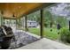 Covered back porch with ceiling fan, seating, and view of backyard at 3034 Cane Slash Rd, Johns Island, SC 29455