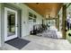 Covered back porch with ceiling fan, seating, and access to backyard at 3034 Cane Slash Rd, Johns Island, SC 29455