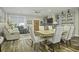 Open concept dining area with wood table and chairs, adjacent to living room at 3034 Cane Slash Rd, Johns Island, SC 29455