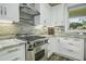 Stainless steel appliances and granite countertops in this kitchen at 3034 Cane Slash Rd, Johns Island, SC 29455