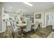 Modern kitchen with white cabinets, granite counters, and stainless steel appliances at 3034 Cane Slash Rd, Johns Island, SC 29455
