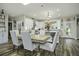 Modern kitchen with white cabinets, granite counters, and stainless steel appliances at 3034 Cane Slash Rd, Johns Island, SC 29455