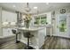 Modern kitchen with white cabinets, granite counters, and an island at 3034 Cane Slash Rd, Johns Island, SC 29455