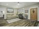 Bright and airy living room with hardwood floors and neutral decor at 3034 Cane Slash Rd, Johns Island, SC 29455