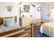 Bright bedroom with twin beds, dresser, and ocean-themed decor at 3611 Yacht Club Rd # B, Edisto Island, SC 29438